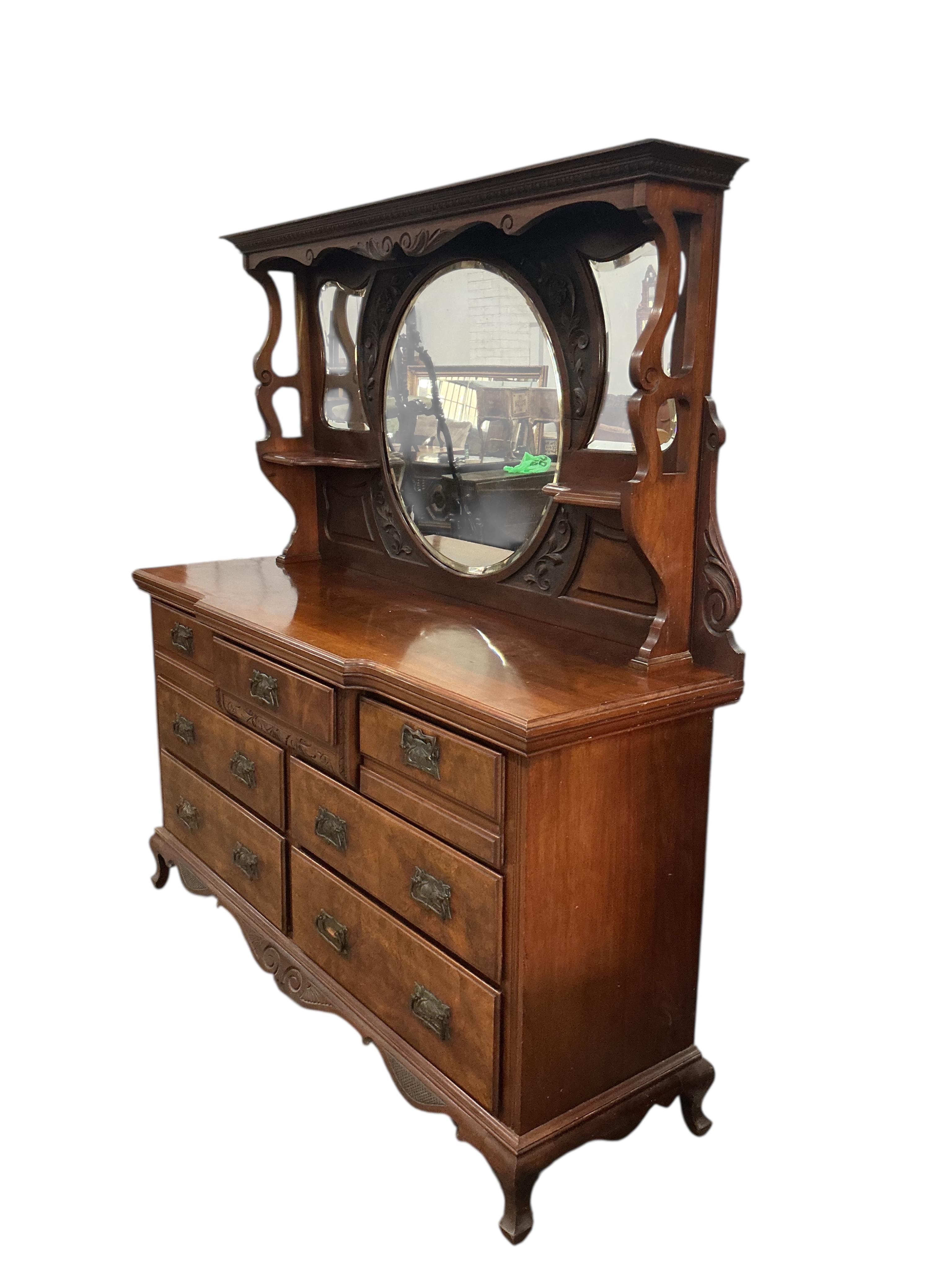 A late Victorian mirrored back walnut sideboard, width 170cm, depth 52cm, height 184cm